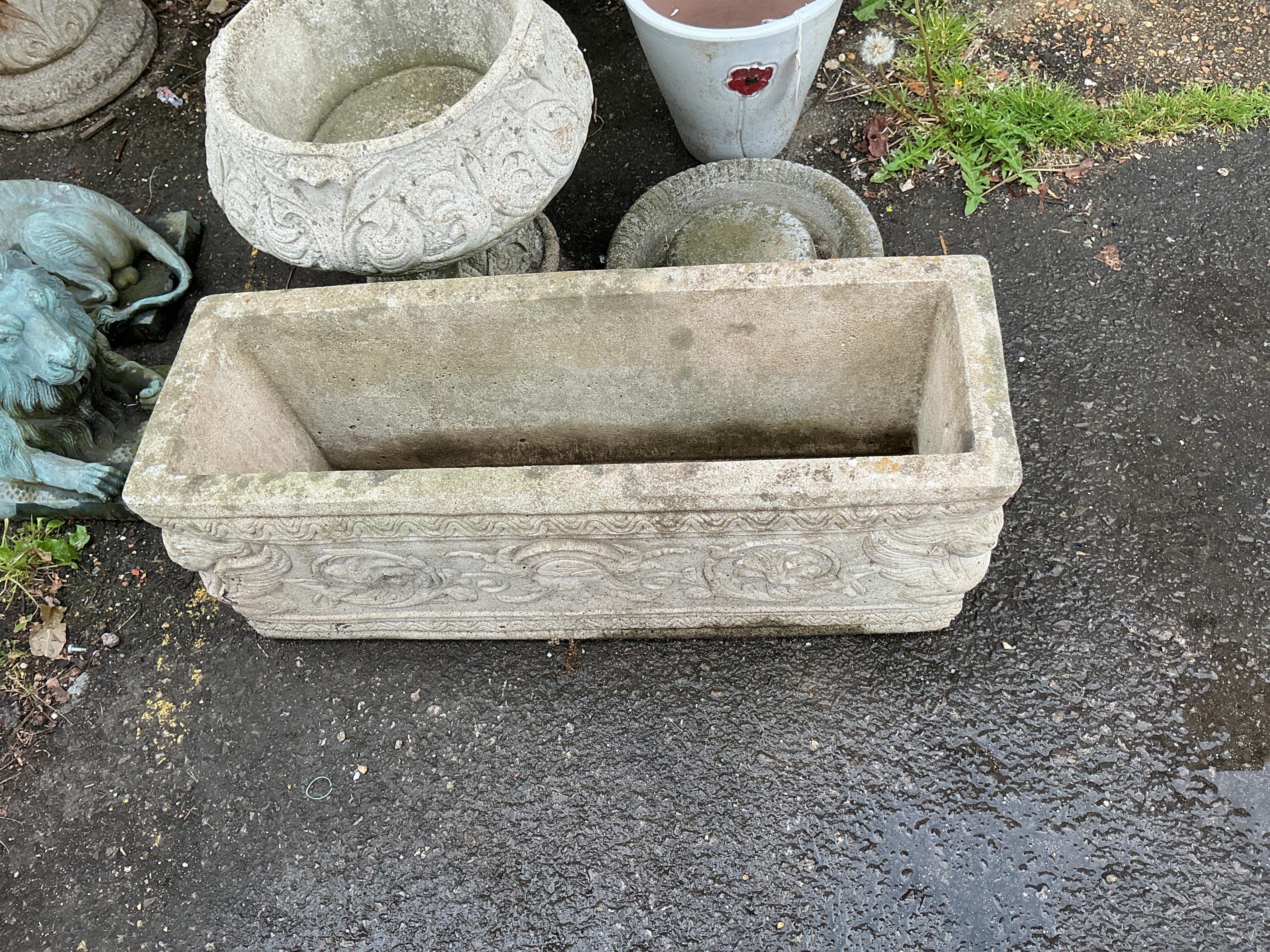 Six assorted stone and earthenware garden planters and a bird bath, largest diameter 38cm, height 32cm